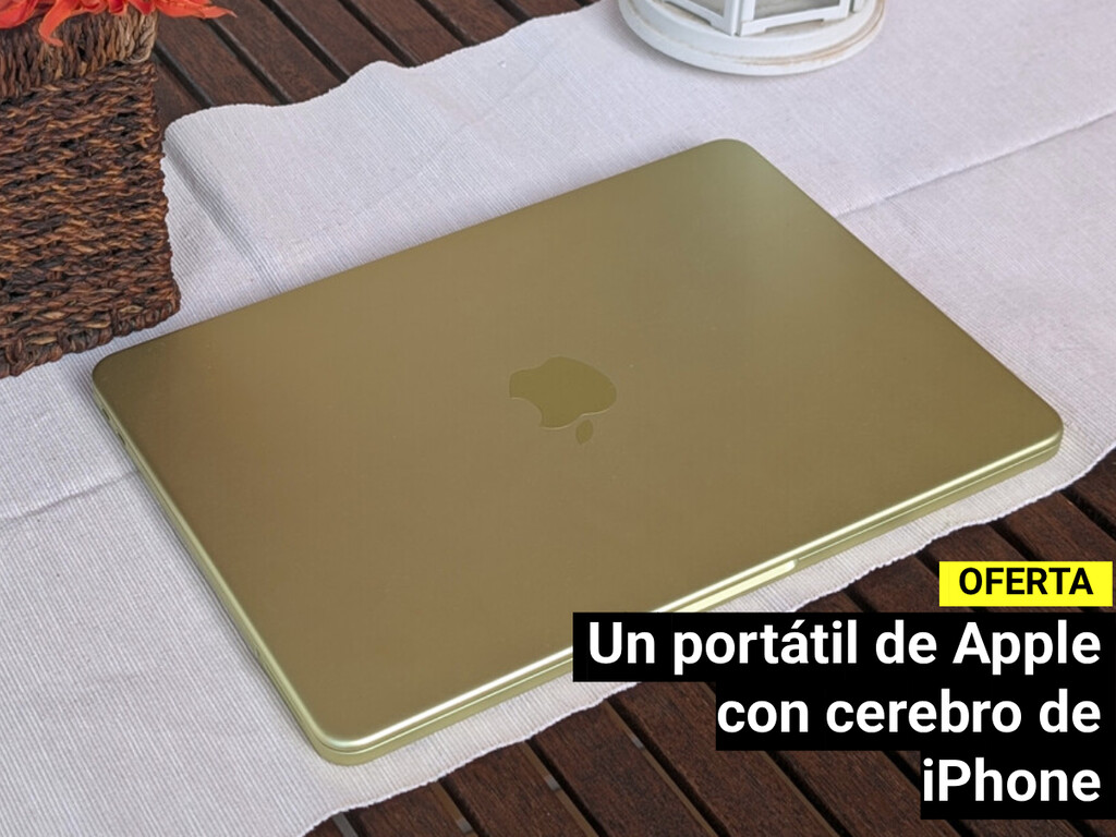 Portátil MacBook Neo en un escritorio con fondo de oficina moderna